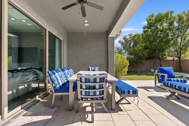 view of patio featuring ceiling fan