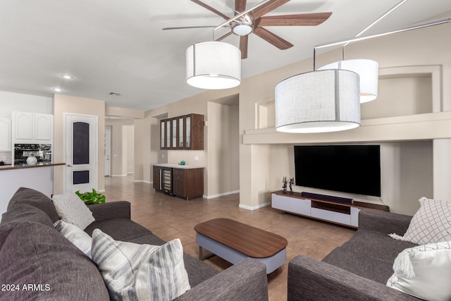 tiled living room featuring ceiling fan