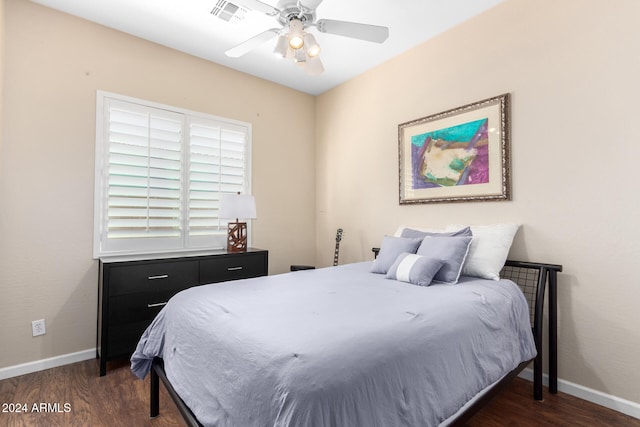 bedroom with dark wood-type flooring and ceiling fan