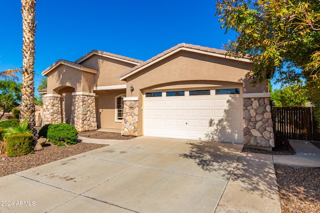 view of front of property featuring a garage