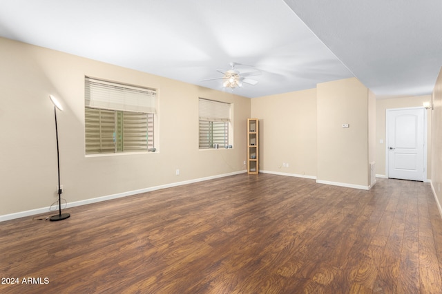 spare room with ceiling fan and dark hardwood / wood-style flooring