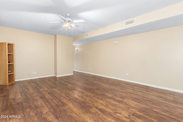 empty room featuring dark hardwood / wood-style floors and ceiling fan