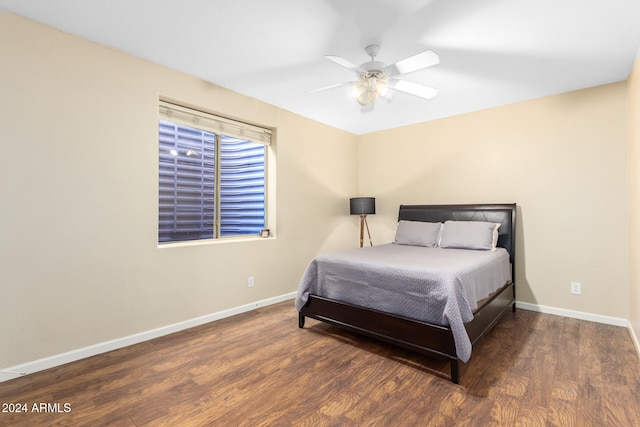 bedroom featuring dark hardwood / wood-style floors and ceiling fan