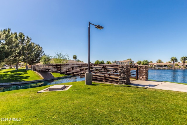 exterior space featuring a water view and a yard