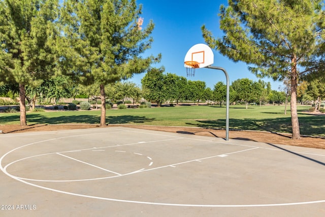 view of basketball court featuring a yard