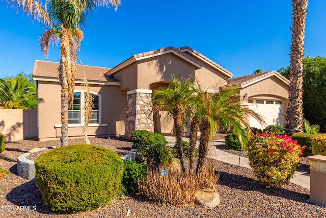 view of front of property with a garage