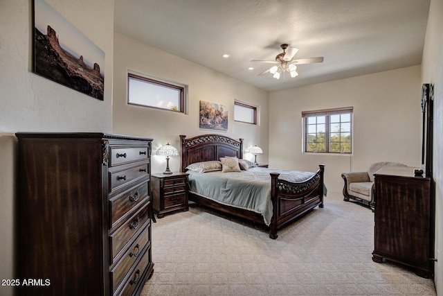 bedroom featuring a ceiling fan, recessed lighting, and light colored carpet