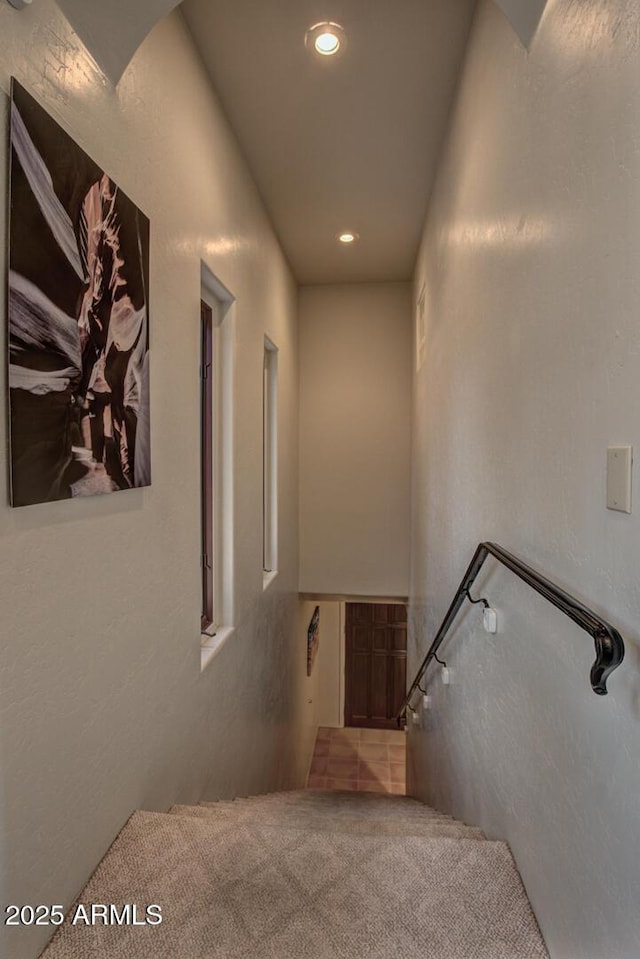 stairs featuring carpet flooring and recessed lighting