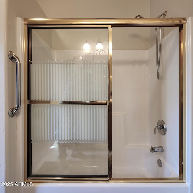 full bathroom featuring shower / bath combination with glass door