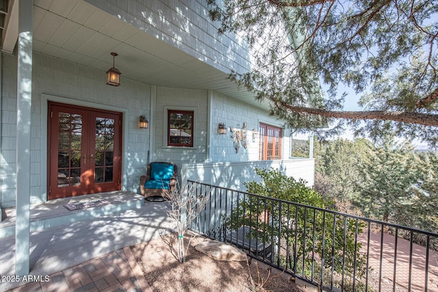 view of patio / terrace with french doors and fence