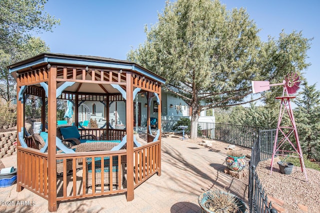 deck featuring a gazebo and fence