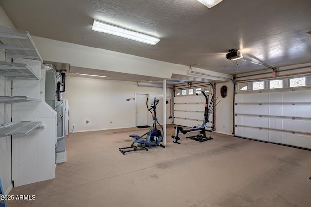 garage featuring a garage door opener and baseboards