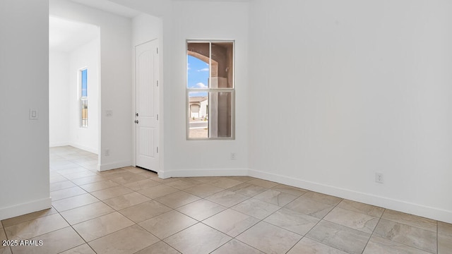 17841 W Windsor Blvd, Litchfield Park, AZ 85340 - empty room featuring baseboards and light tile patterned flooring
