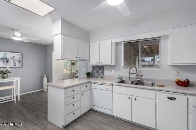 kitchen featuring kitchen peninsula, white cabinetry, sink, ceiling fan, and white dishwasher