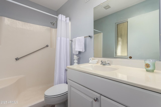 bathroom with vanity, toilet, and a shower with shower curtain