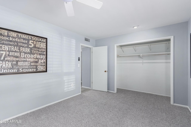 unfurnished bedroom featuring carpet floors, ceiling fan, and a closet