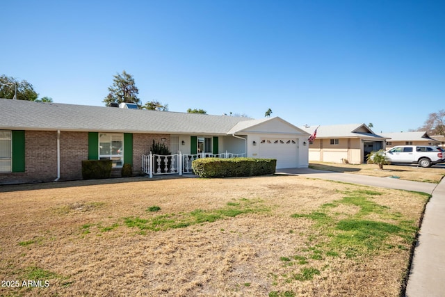 ranch-style home featuring a garage and covered porch