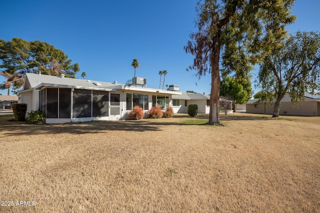 rear view of house with a lawn