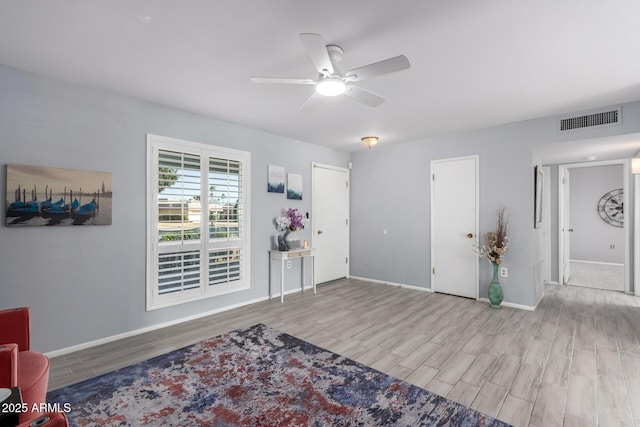 foyer entrance featuring ceiling fan and light hardwood / wood-style floors