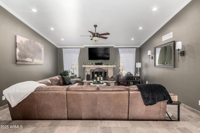 living room featuring ornamental molding and ceiling fan