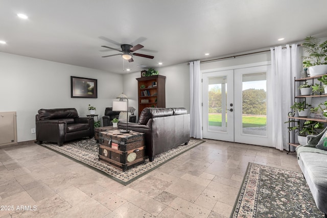 living room featuring french doors and ceiling fan