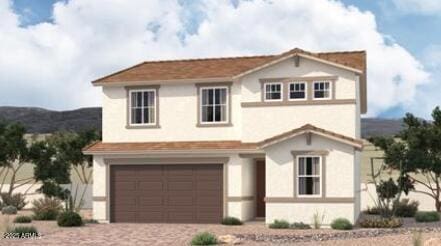 view of front of property featuring decorative driveway and an attached garage