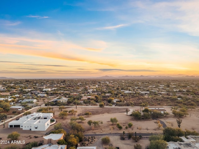 aerial view at dusk featuring a residential view