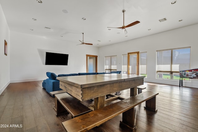 playroom with baseboards, ceiling fan, visible vents, and dark wood-type flooring