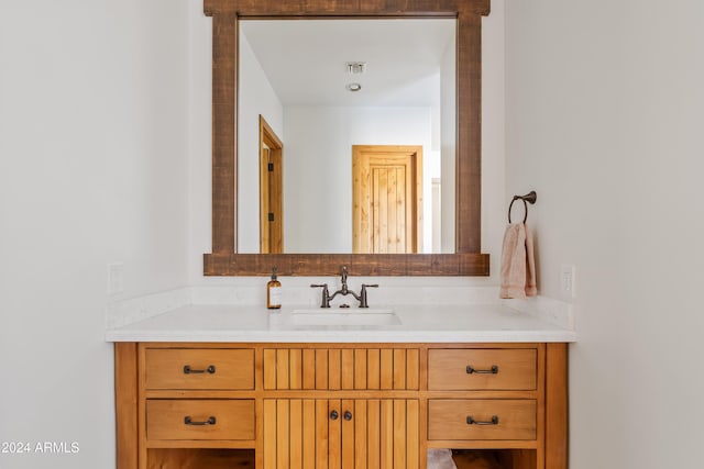 bathroom with vanity and visible vents