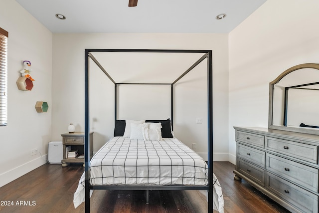 bedroom featuring dark wood-type flooring, recessed lighting, and baseboards