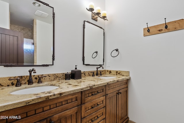 full bathroom with a sink and double vanity