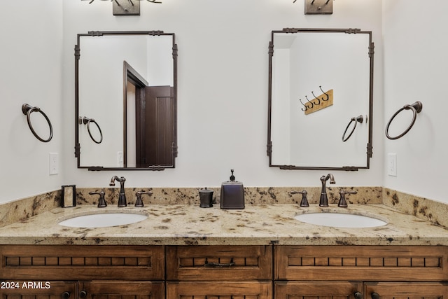 bathroom with double vanity and a sink