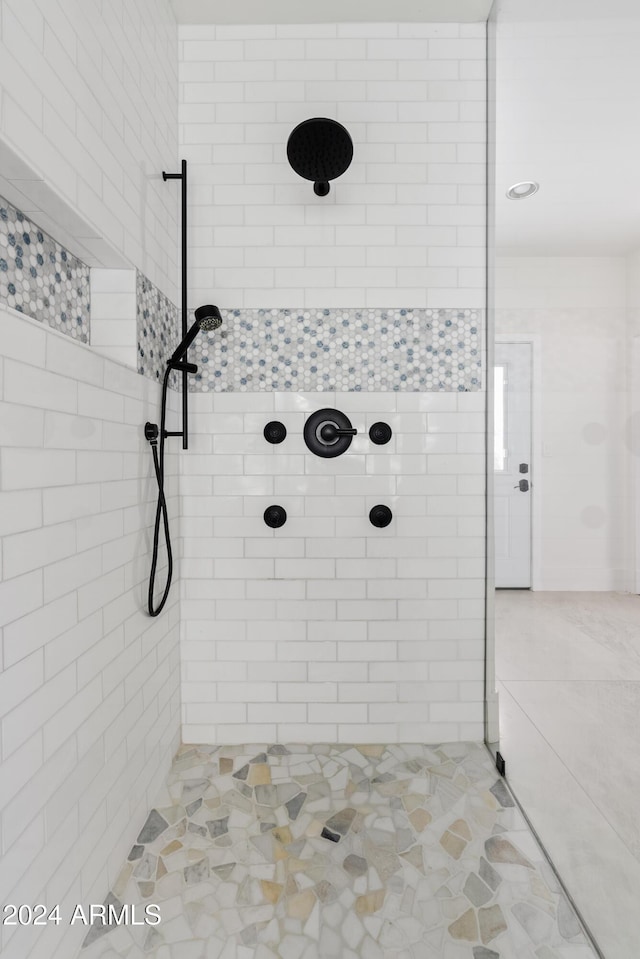 bathroom with a tile shower