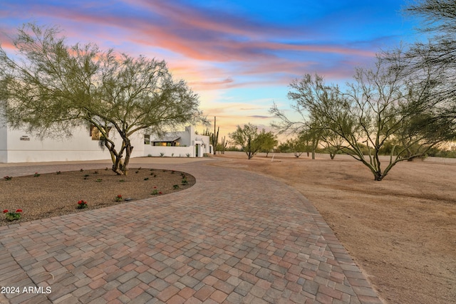 exterior space featuring decorative driveway