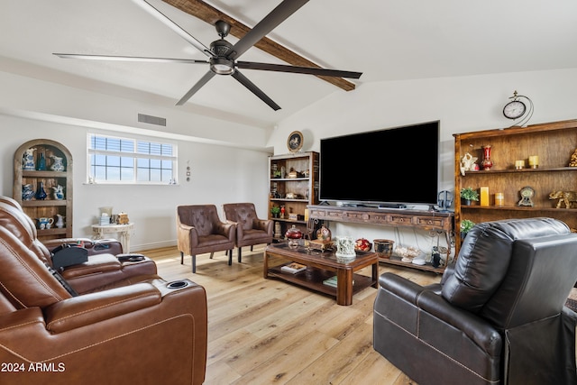 living area featuring lofted ceiling with beams, light wood-style flooring, visible vents, and a ceiling fan