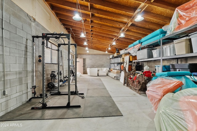 workout room featuring concrete block wall