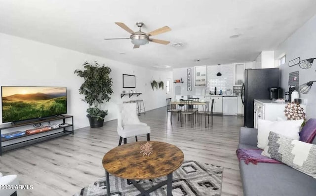 3330 E Cypress St, Phoenix, AZ 85008 - living room featuring light wood-style floors and ceiling fan