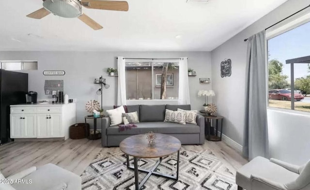 3330 E Cypress St, Phoenix, AZ 85008 - living area with light wood-style floors and ceiling fan