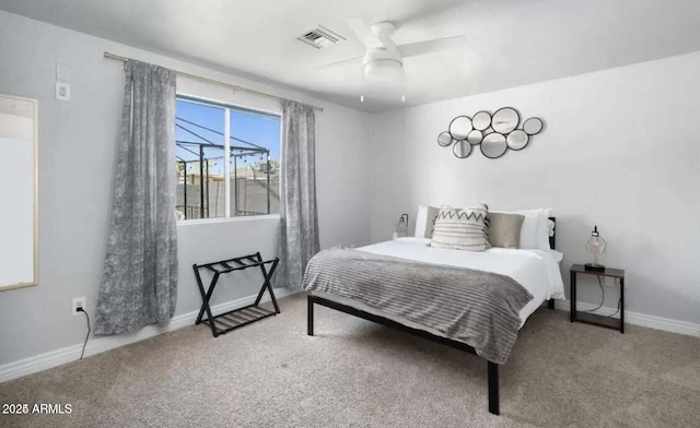 3330 E Cypress St, Phoenix, AZ 85008 - carpeted bedroom featuring baseboards and a ceiling fan