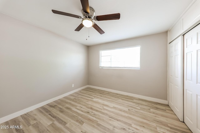 3238 W Rose Ln, Phoenix, AZ 85017 - unfurnished bedroom with light wood finished floors, a closet, and a ceiling fan