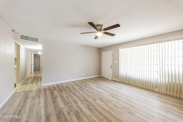 3238 W Rose Ln, Phoenix, AZ 85017 - empty room with a ceiling fan and light wood-style flooring