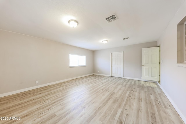 3238 W Rose Ln, Phoenix, AZ 85017 - spare room featuring light wood-style floors and baseboards