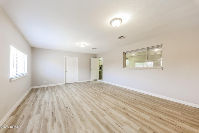 3238 W Rose Ln, Phoenix, AZ 85017 - empty room featuring light wood-style floors and baseboards