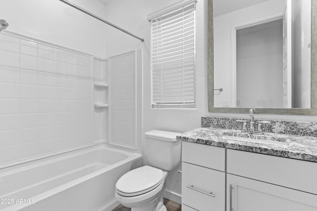 full bathroom with vanity, toilet, and shower / tub combination