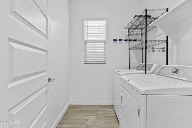 laundry area with separate washer and dryer