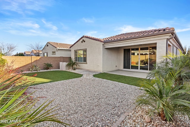 back of property featuring a patio