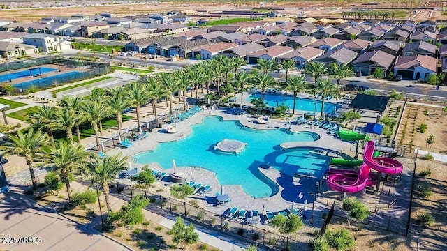 view of swimming pool with a water slide