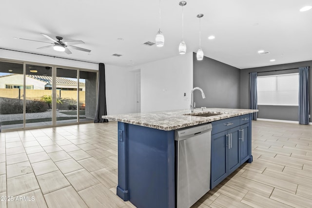 kitchen with pendant lighting, dishwasher, an island with sink, sink, and blue cabinetry