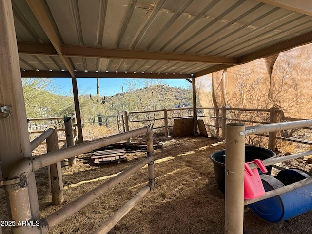 exterior space featuring a mountain view and an outdoor structure