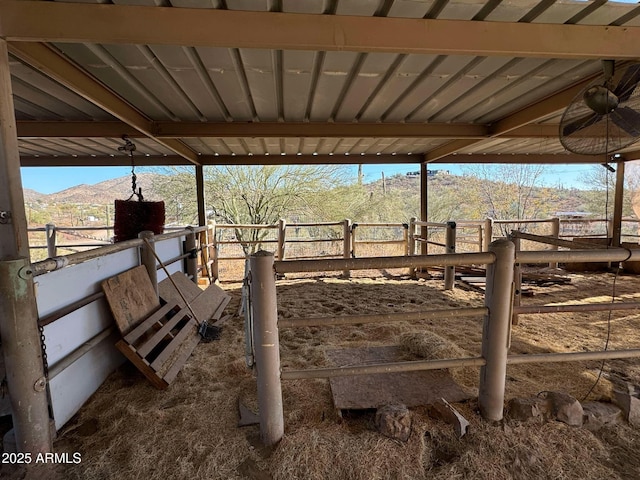 view of horse barn featuring a mountain view